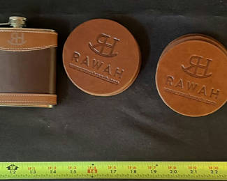 Lot 24: Leather-wrapped hip flask with coasters