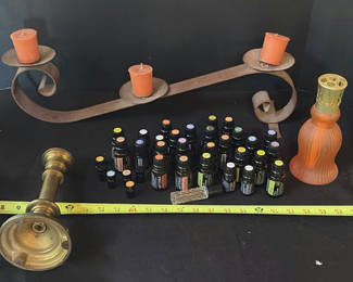 Lot 26: Assorted fragrance bottles, diffuser, and decorative candlesticks