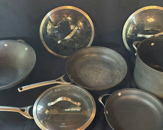 Lot 49: Calphalon cookware set with pots, pans, and glass lids