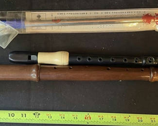 Lot 20: Wooden and plastic recorders with packaged Oak Penny whistle