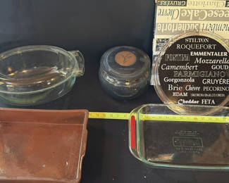 Lot 39: Glass bakeware, stoneware jar, and cheese board collection