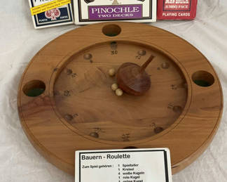 Lot 156: Bauern-Roulette round wooden game board with playing card decks