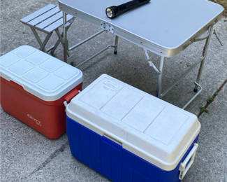 Lot 122: Folding camping table with two coolers, flashlight, and folding stool