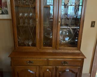 Ethan Allen Heirloom nutmeg maple buffet with matching china cabinet.