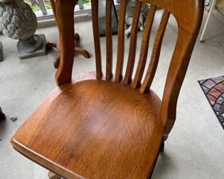 Vintage wood swivel banking chair.