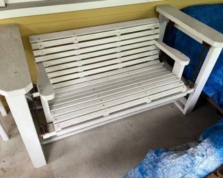White wooden porch glider.