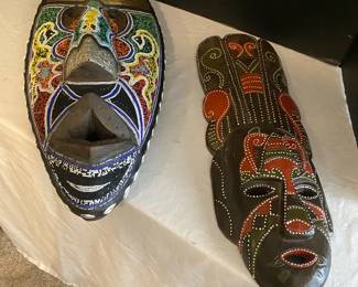 Two Ornate Hand Carved Masks