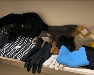 A Lot Of Winter Scarves, Hats, And Gloves