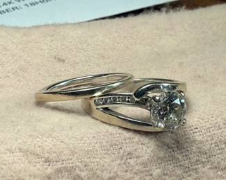 This lot features a stunning 14k gold & natural diamond wedding ring and band. Total approx. weight of 7.49 grams and come in a size 7. Purchased from Shane Jewelers in 2018 and comes with an appraisal for the 1.33 carat natural diamond as shown in photos. $6,400 valued appraisal from 2018 for both rings.
