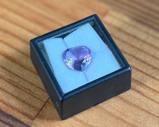 This lot features an incredible Amethyst "heart" gemstone that measures 14mm x 14mm and has a 7.80 carat weight.
