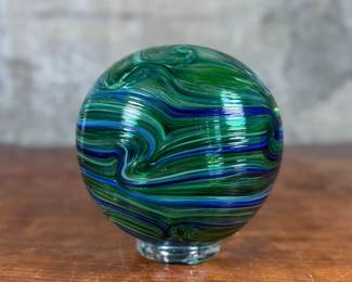 This lot features a stunning hand made blown glass float from Oregon Coast Taft circa 2018. This float measures, 7” H x 7” W.