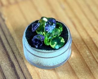 This lot features a beautiful collection of eleven (11) Amethyst and Peridot gemstones.