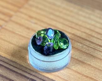 This lot features a beautiful collection of eleven (11) Amethyst and Peridot gemstones.