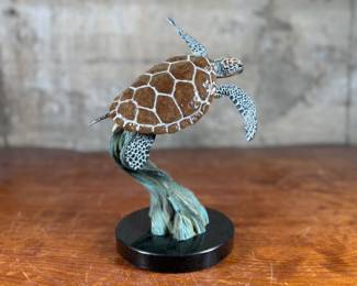 “Ancient Mariner”, an original limited edition bronze sculpture by listed artist, Robert Wyland. Signed with edition in photos. This bronze sculpture measures, 10.5” H.