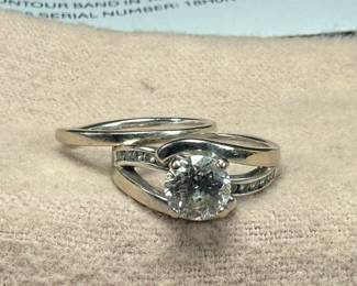 This lot features a stunning 14k gold & natural diamond wedding ring and band. Total approx. weight of 7.49 grams and come in a size 7. Purchased from Shane Jewelers in 2018 and comes with an appraisal for the 1.33 carat natural diamond as shown in photos. $6,400 valued appraisal from 2018 for both rings.
