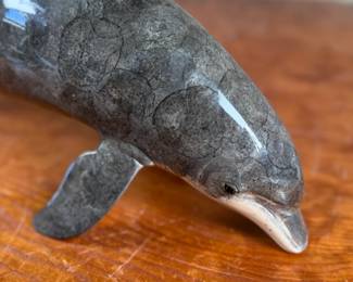 This lot features a stunning dolphin door handle, famously seen on doors when entering a Wyland gallery. Crafted from cast bronze with a rich, detailed patina finish. The handle measures, 19” W with 12” in between each screw mount.