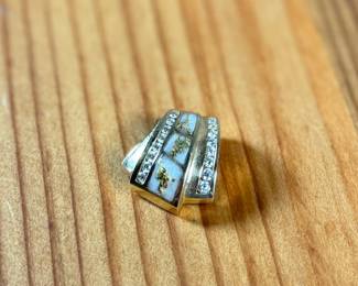 This lot features a stunning hand made 14k gold pendant with genuine diamonds and gold flake accents. Total approx. weight of 9.46 grams. XRF tested at 14k with the flakes testing at around 18k.