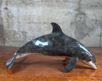 This lot features a stunning dolphin door handle, famously seen on doors when entering a Wyland gallery. Crafted from cast bronze with a rich, detailed patina finish. The handle measures, 19” W with 12” in between each screw mount.