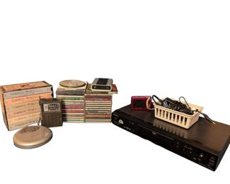 Dvd And Cd Player With Many Cds And Smaller Electric Devices