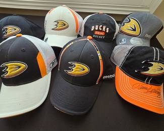 New Anaheim Ducks caps (one on the right autographed by Teemu Selanne)