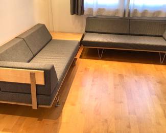 Pair of Modernica Case Study V-leg daybeds with arms 