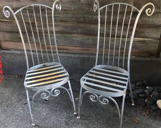 Pair of whimsical iron highback chairs (39” tall)