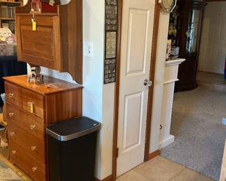 trash can, clock and wall art