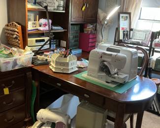 Thomasville tall bookcase with extended table, Thomasville tall cabinet with file drawers and storage, sewing machines, etc.