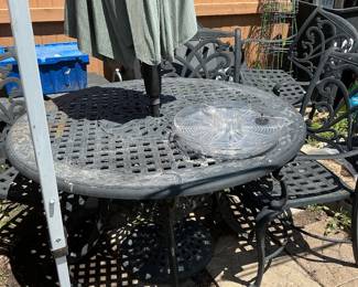 round patio table, umbrella and 4 chairs