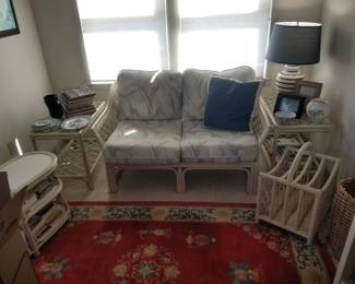 White rattan loveseat, end tables and magazine racks