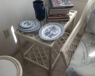 White rattan end table; blue & white china