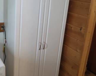 Tall white utility cabinet