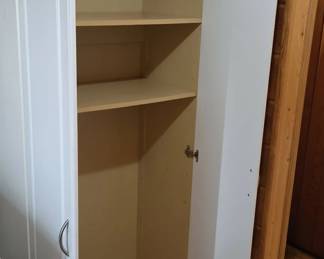 Tall white utility cabinet