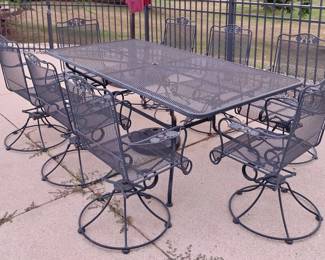 Woodard patio table with 8 spring rocker chairs
