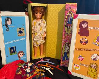 vintage 1968 Ideal Crissy doll features a unique "grow hair" mechanism and includes her original fashion steamer trunk and extra clothing