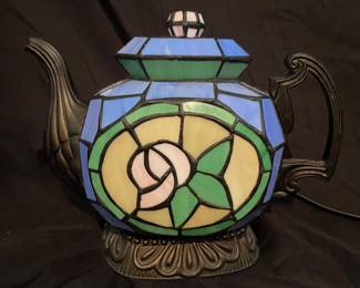 Vintage Cheyenne Tiffany Style Teapot Lamp featuring blue and green stained glass with a white rose design