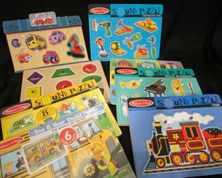 collection features several Melissa & Doug wooden sound puzzles, including a prominent Train Sound Puzzle