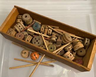 vintage Tinkertoy wooden building set, likely dating from the 1920s to 1970s