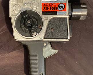 1965 Mattel Agent Zero M Movie Shot spy camera cap gun.It is a vintage toy designed to look like a movie camera that flips into a cap-firing pistol