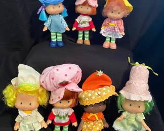 collection of vintage Strawberry Shortcake dolls originally produced by Kenner in the 1980s