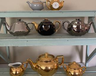 vintage teapots, including brands like Hall China, feature metallic gold lustre finishes