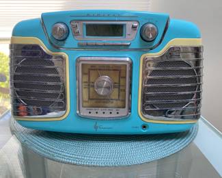 Emerson Retro 1950's Style Table Radio (model RET66TQ), featuring a distinctive turquoise body with cream accents