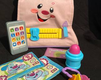 Fisher-Price Laugh & Learn My Pretty Learning Purse, a pink toy bag with a smiling face and musical features