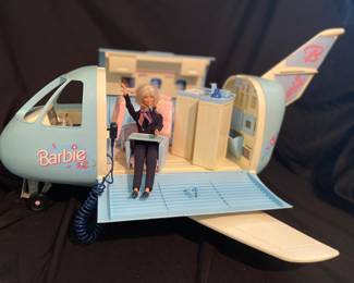 vintage 1999 Mattel Barbie Jumbo Jet airplane, featuring a blue and white body and a side panel that opens to reveal a cabin