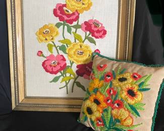 a handmade vintage crewel embroidered picture and a matching floral throw pillow