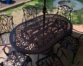 9-Piece Outdoor Patio Dining Set featuring a dark brown cast aluminum finish