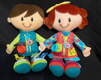 Playskool Dressy Kids plush dolls designed to help toddlers practice dressing skills like zipping, buttoning, and buckling