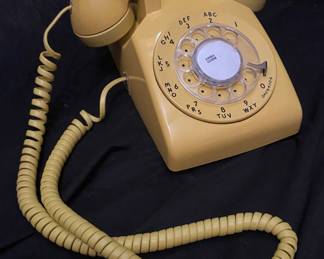 vintage yellow Western Electric 500 series desk phone, a classic Bell System model
