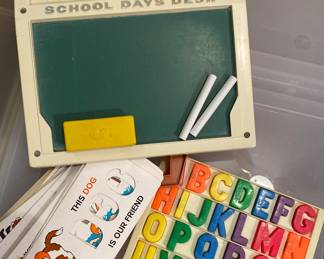 a vintage 1972 Fisher-Price School Days Desk (#176), featuring a green chalkboard, yellow eraser, and white chalk