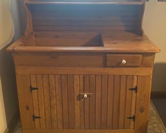 antique-style dry sink cabinet is likely made of pine and features bead board doors